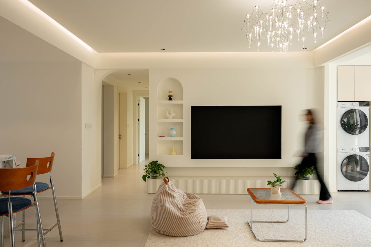 about-us Minimalist living room interior with chic lighting, modern furniture, and soft ambiance.