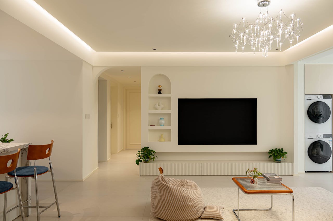 Stylish living room featuring modern minimalist design with elegant lighting and cozy furnishings.